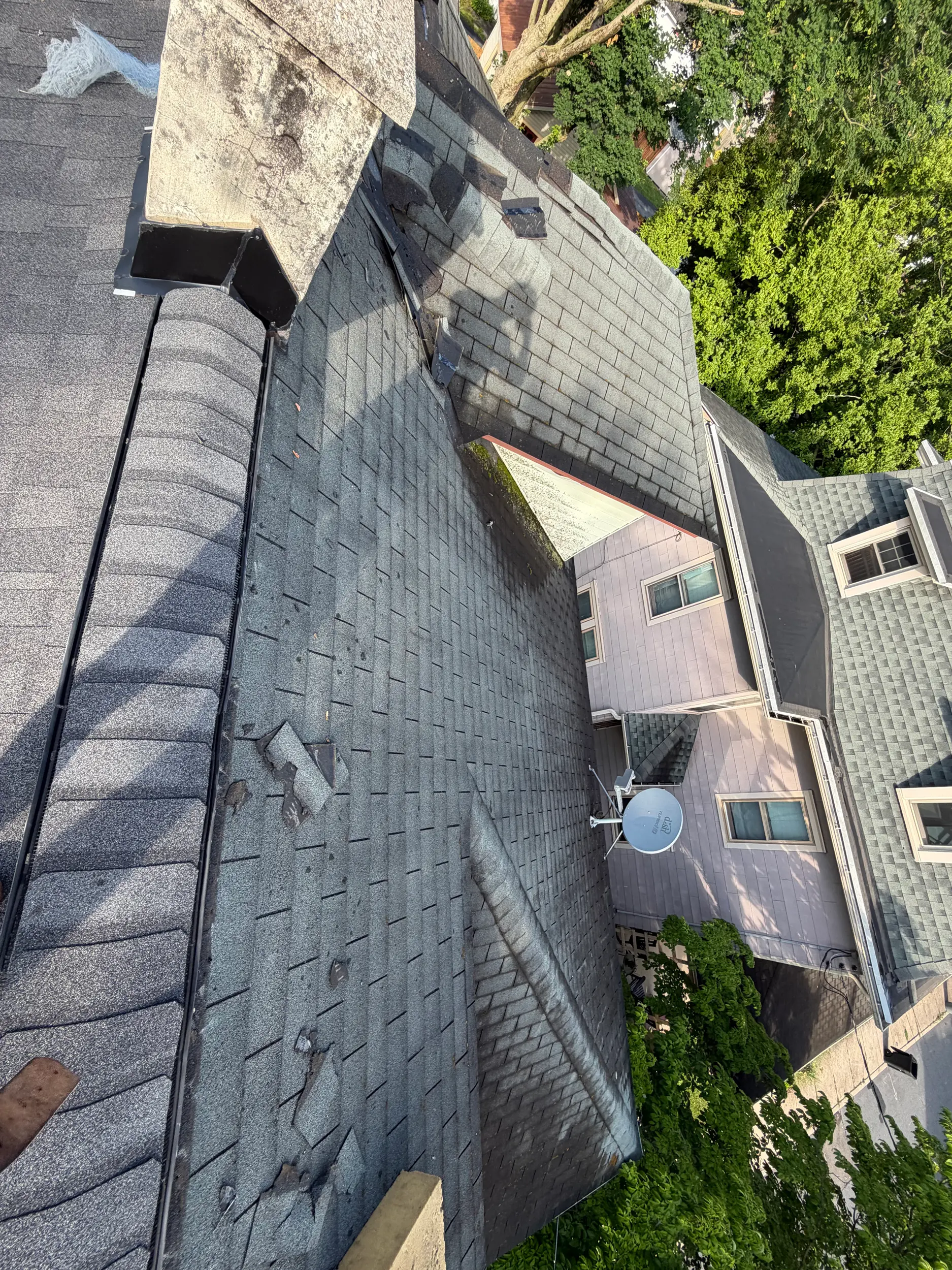 Aerial view of a roof and chimney inspected and repaired by Quietstorm Exteriors in Lancaster, PA